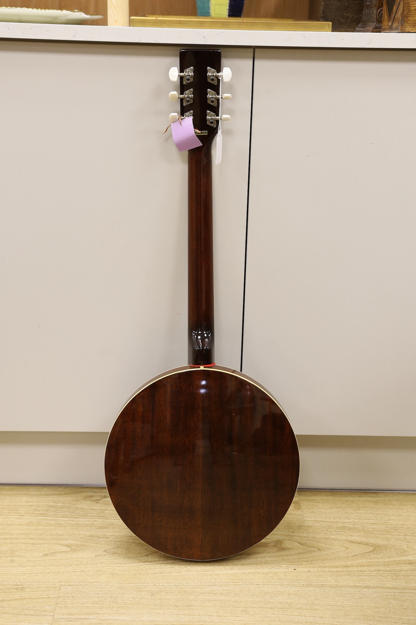 An Ashbury banjo - U.S.A. Weatherking with soft padded case, Banjo 86.5 cms high